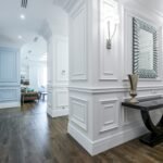 Luxurious hallway with modern decor and wooden floor, showcasing minimalism.